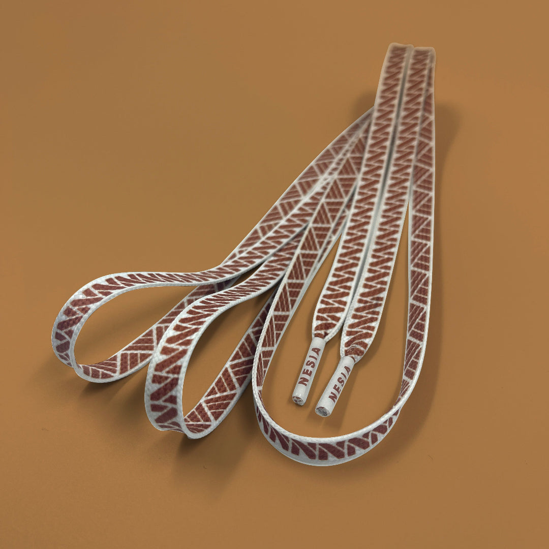 Nesia Originals Polynesian Tapa design shoelaces on brown background